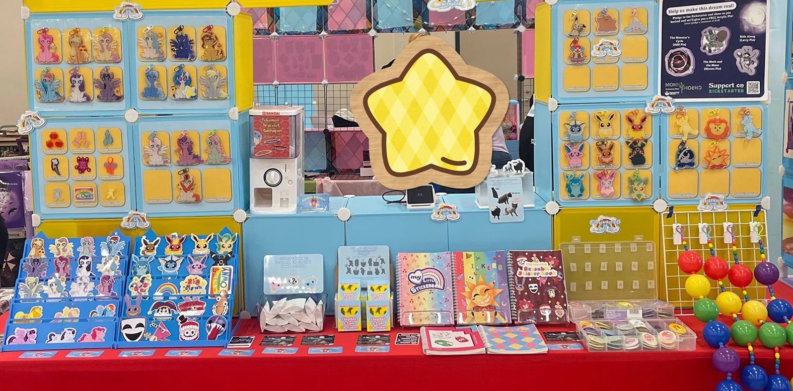 My booth at conventions, it is very bright and colorful (Red, blue and yellow) with lots of textures (Smooth, bumpy, and soft).